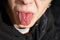 Teen shows tongue with piercing