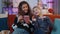 Teen sisters kids celebrate success win scream rejoices while doing online shopping on smartphone
