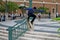 Teen skating doing jump