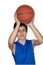 Teen sportsman playing basketball