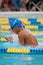 Teen Swimmer Does Breaststroke in Swim Meet