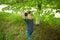 Teen takes a selfie near a tree