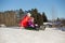 Teen and toddler sledding