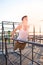 Teen training on parallel bars outdoors