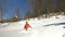 Teen walking in deep snow and falling into it at the mountain