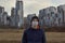 Teen wearing a medical mask against the background of a city against quarantine selective focus