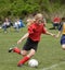 Teen Youth Soccer Player Kicking Ball