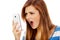 Teenage angry woman screaming into the phone