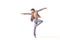 A teenage ballet dancer poses barefoot,  on a white background