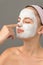 Teenage beauty girl touch nose facial mask