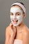 Teenage beauty smiling girl white facial mask