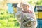 Teenage beekeeper working in apiary