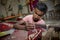 A teenage boy adds detail to a traditional Jamdani saree in Mirpur Benarashi Palli, Dhaka, Bangladesh.