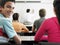 Teenage Boy Attending Lecture In Classroom