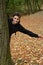 Teenage boy in autumn forest