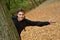 Teenage boy in autumn forest