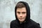 Teenage boy in black hoodie
