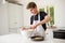 A Teenage Boy Cooking In A Kitchen