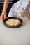 A Teenage Boy Cooking In A Kitchen