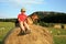 Teenage boy with dog on the meadow