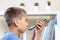 Teenage boy doing homework, using cell phone recording and send a voice message, making voice call