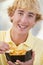 Teenage Boy Eating French Fries