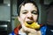 Teenage boy eats slice of bread with jam for snack