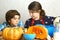 Teenage boy and girl cooking pumpkin pie