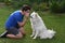 Teenage boy and his samoyed