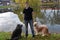 Teenage boy and his two big dogs at a lake