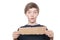 Teenage boy holding a brown piece of cardboard