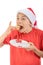 Teenage boy isolated on white background with a mince pie