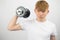 Teenage boy lifting a dumbbell