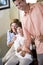 Teenage boy and parents at home looking excited