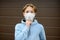 A teenage boy put on a face mask because the second wave of the covid-19 epidemic began. Lockdown. The mask is the new standard