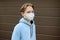 A teenage boy put on a face mask because the second wave of the covid-19 epidemic began. Lockdown. The mask is the new standard