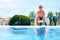 Teenage boy relaxing near the pool