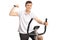 Teenage boy riding an exercise bike and flexing his biceps