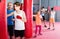 Teenage boy sportsman training at boxing