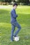 Teenage Boy Standing On Soccer Ball