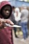 Teenage Boy In Urban Gang Pointing Knife Towards Camera