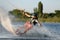 Teenage boy wakeboarding on river. Extreme water sport