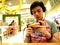 A teenage boy watches a movie on his smartphone while at a mall in Antipolo City, Philippines