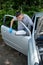 Teenage boy working on a car