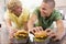 Teenage Boys Eating Burgers