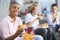 Teenage boys enjoying fast food lunches together