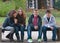 Teenage boys and girls having fun in the park