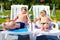 Teenage boys relaxing on sunbeds in waterpark