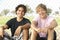 Teenage Boys Sitting In Playground