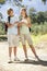 Teenage Couple Hiking Through Countryside